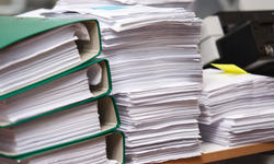 Close up stack of paper on the office desk